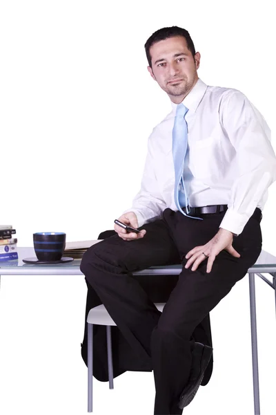 Affärsman sitter vid sitt skrivbord — Stockfoto