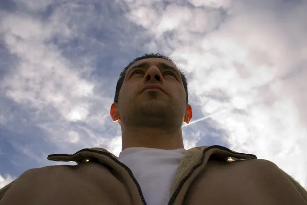 stock image Man Looking up with the Clouds