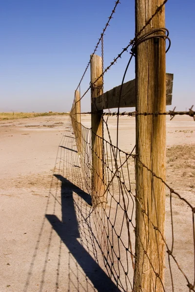 stock image Wire and Wooden Fence Under Clear Skies