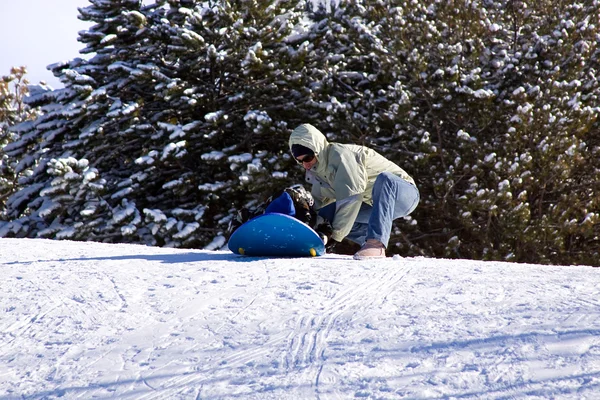 Mother and Son Sledding down the Hill Royalty Free Stock Photos