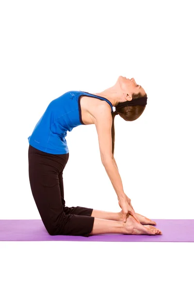 Kvinna i yogaposition Stockbild