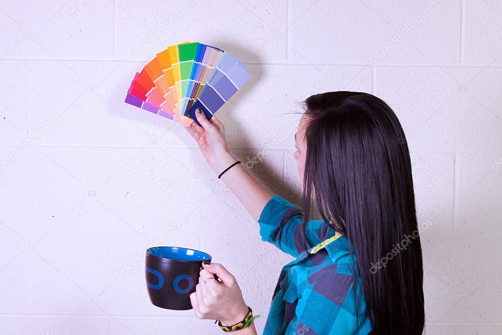 Girl Choosing a Color for the Walls
