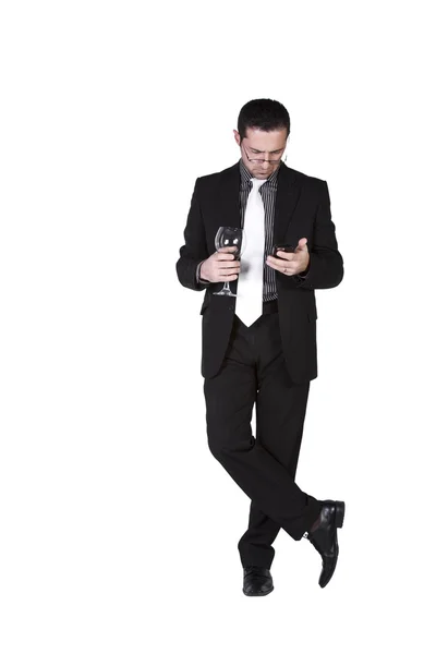 Businessman with a glass of drink — Stock Photo, Image