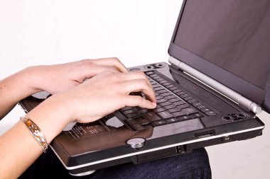 Close up on a Girl's hands typing clipart