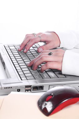 Close up on a Girl's hands typing clipart