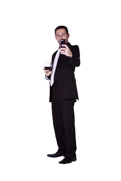 Businessman with a glass of drink — Stock Photo, Image