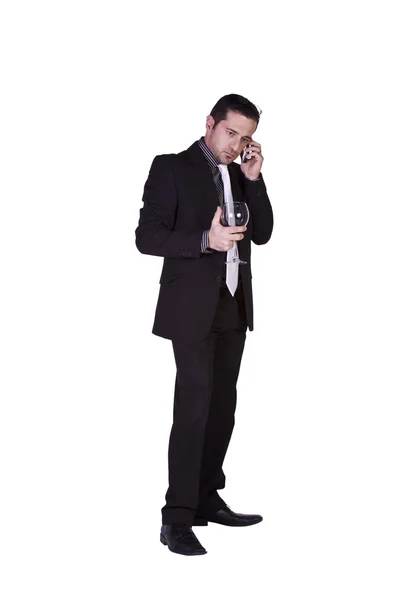 Businessman celebrating with a glass of drink — Stock Photo, Image