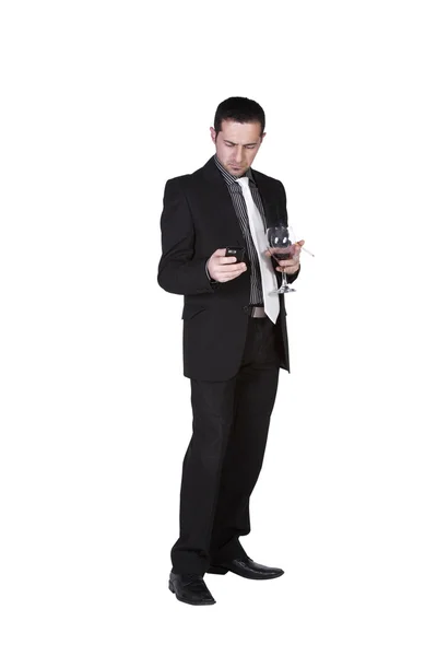 Бизнесмен празднует со стаканом напитка и сигаретой — стоковое фото