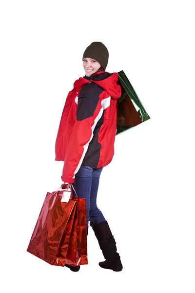 一个漂亮的女孩带着购物袋的孤立的镜头 — 图库照片
