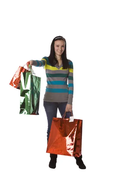Tiro isolado de uma menina bonita com sacos de compras — Fotografia de Stock