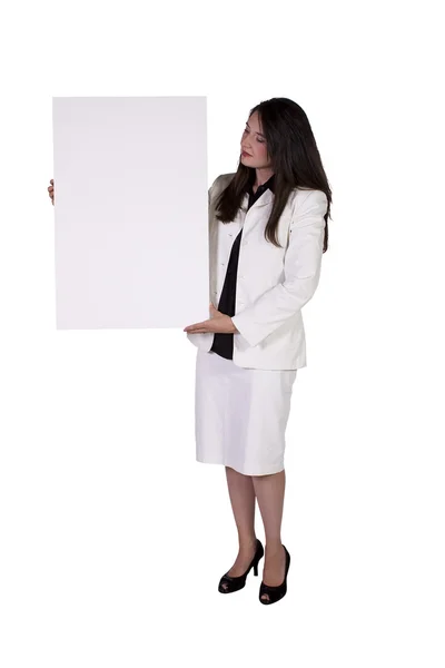 Mujer sosteniendo un signo en blanco —  Fotos de Stock