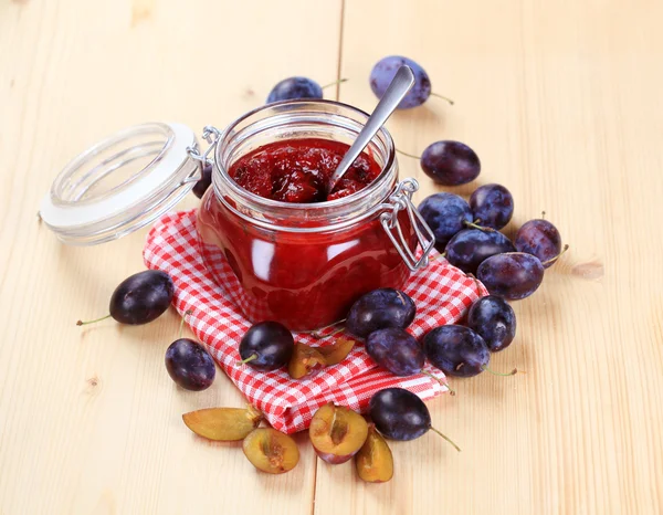 Jar of plum preserve — Stock Photo, Image