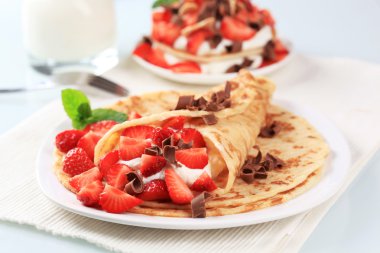 Crepes with cheese and strawberries clipart