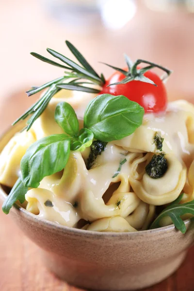 Tortellini with cheese sauce — Stock Photo, Image