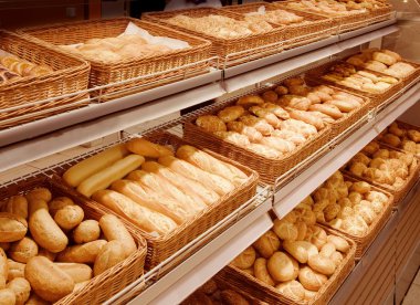 Variety of baked products at a supermarket clipart