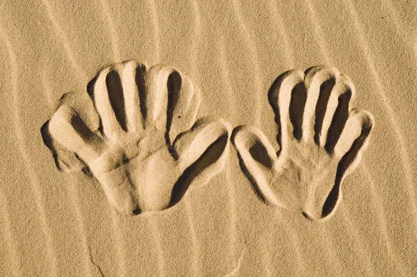 Hand prints in the sand — Stock Photo, Image