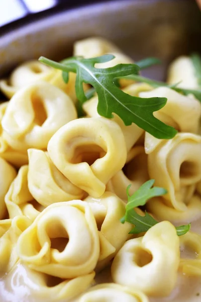 Tortellini and cream sauce — Stock Photo, Image