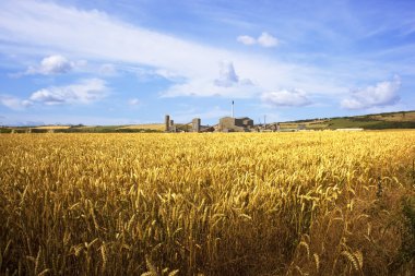 A potash mine with wheat fields clipart