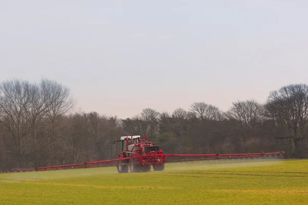 Crop spraying in springtime — Stock Photo, Image
