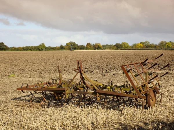 Harrows in a plowed field — Stock Photo, Image