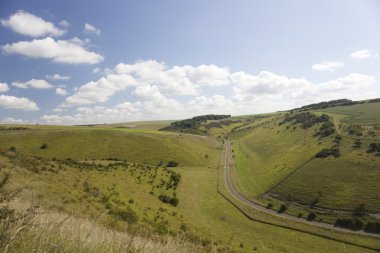 Summer sky over hillside pastures clipart