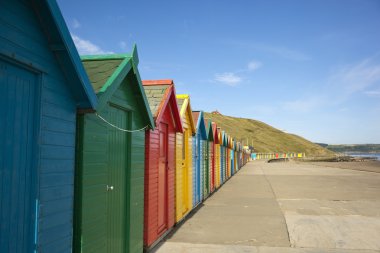 Colourful beach huts clipart