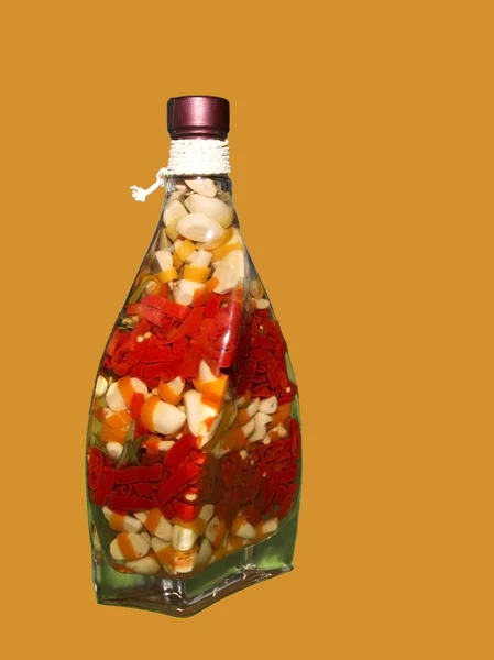 Chillies and garlic vinegar bottle — Stock Photo, Image