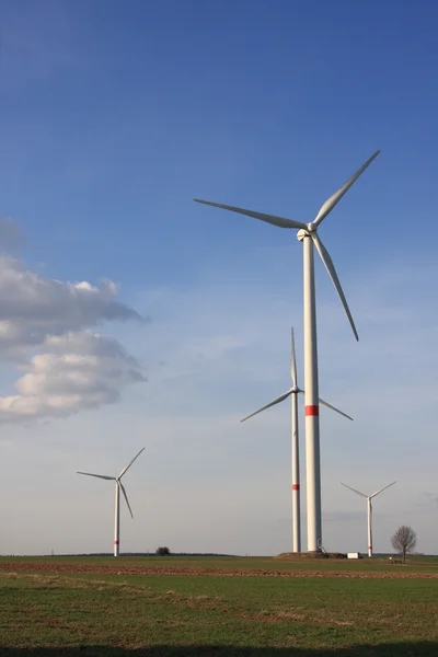 Wind turbines under blue sky — Stock Photo, Image