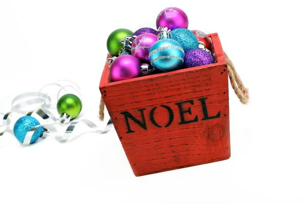 Christmas ornaments in a wooden box — Stock Photo, Image