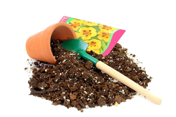 Garnek glina, gleby, nasiona i łopata. — Zdjęcie stockowe
