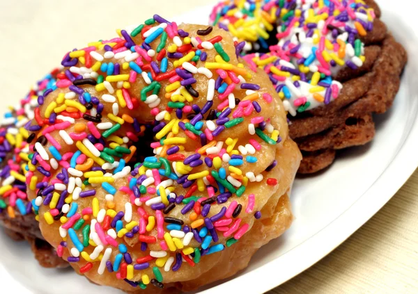 Colorful sprinkled doughnuts. — Stock Photo, Image