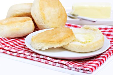 Dinner biscuits with melting butter. clipart