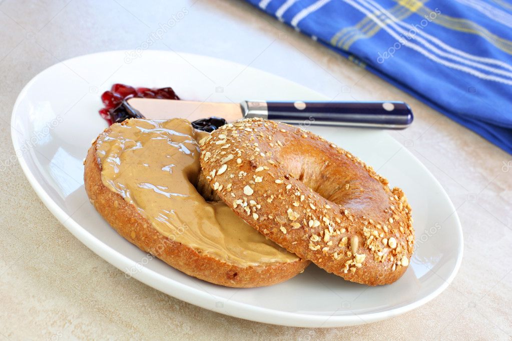 Healthy oat bagel and peanut butter.
