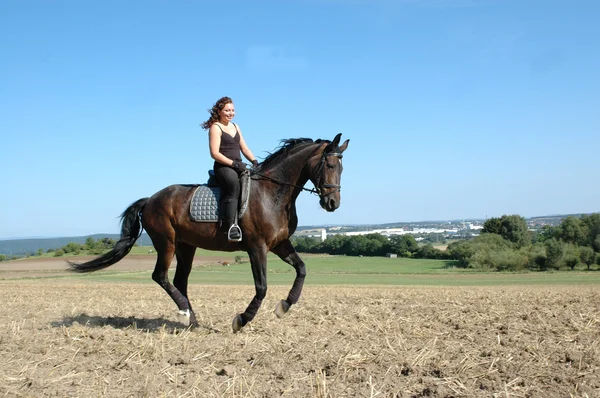 Gallop. Horse and equestrienne. — Stock Photo, Image