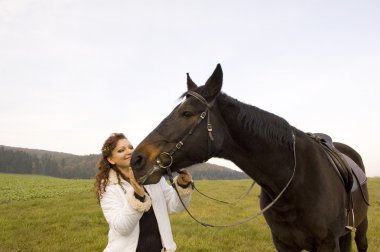 Horsewoman and horse. clipart