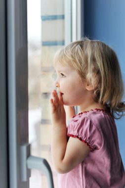 Girl by window clipart