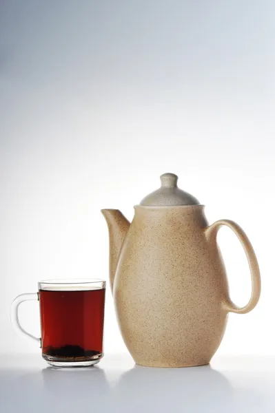 stock image Cup of tea and teapot