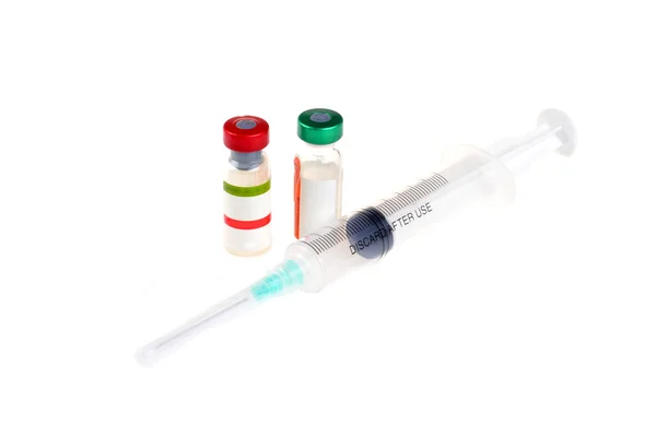 Two vial and syringe — ストック写真
