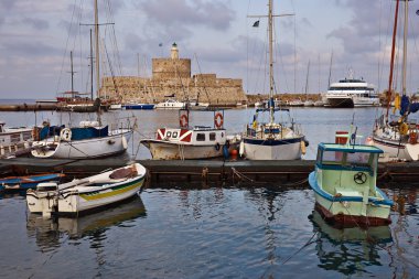 Mandraki Harbor And Lighthouse clipart