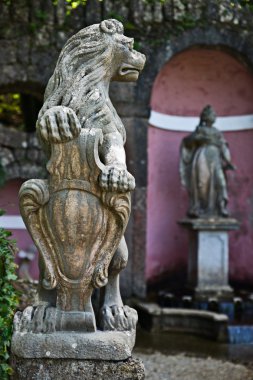 Lion statue in the Hellbrunn Palace clipart