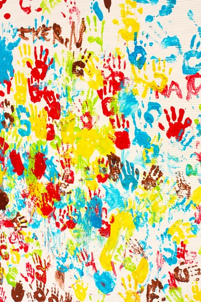 stock image Handprints in different colors in a mural.