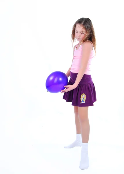 Chica con un globo Imágenes de stock libres de derechos