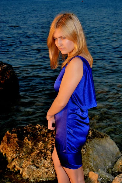 A thoughtful girl in violet dress — Stock Photo, Image