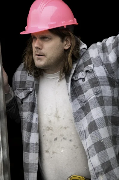 Man in roze veiligheidshelm — Stockfoto