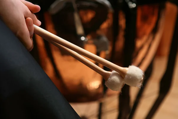 Pair of hands holding drumsticks — Stock Photo, Image