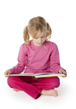 Six Year Old Girl Reading a Book clipart