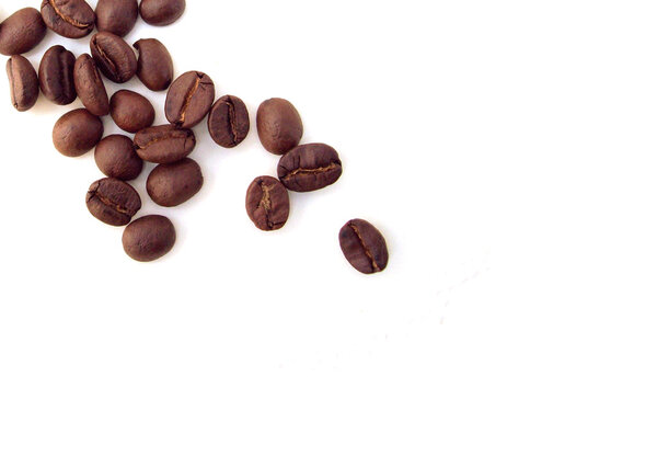 A pile of coffee beans shot on a white background.