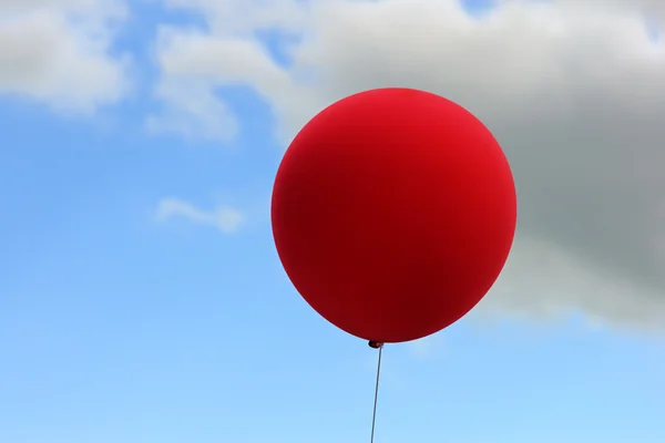 Red balloon on sky background — Stock Photo, Image
