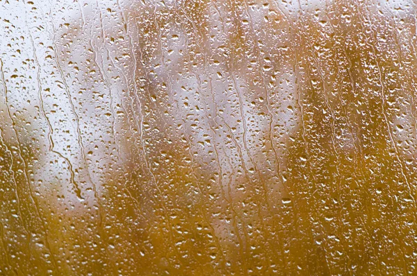 Cae lluvia sobre la ventana — Foto de Stock