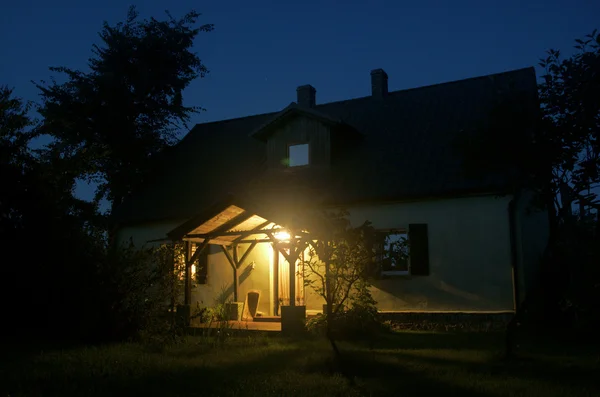 stock image Cottage by night